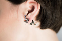 optical illusion accessory jurassic park theme accessory illusion earrings dinosaur illusion earrings illusion accessory illusion accessories dinosaur earrings